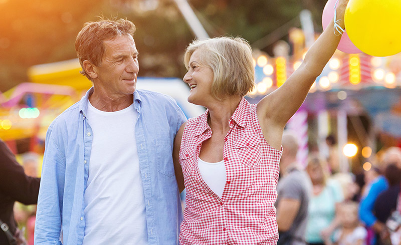 woman and man celebrating at carnival